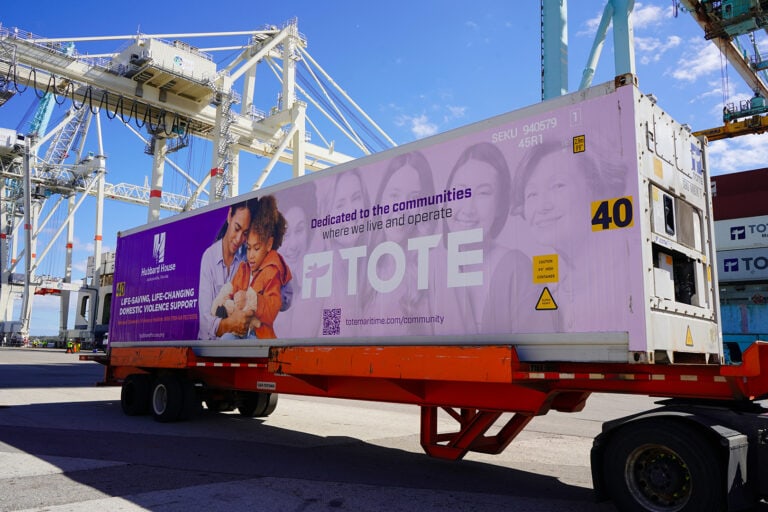 Container with TOTE Maritime Puerto Rico branding at port terminal.