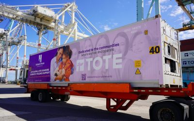 Container with TOTE Maritime Puerto Rico branding at port terminal.